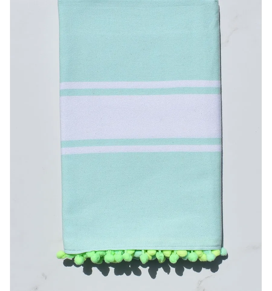 Fouta acqua limpida e verde con pompon 